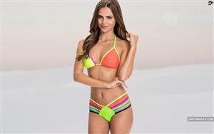 Xenia Deli flaunting her exemplary midriff in a colorful bikini